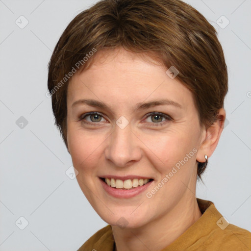 Joyful white young-adult female with short  brown hair and grey eyes