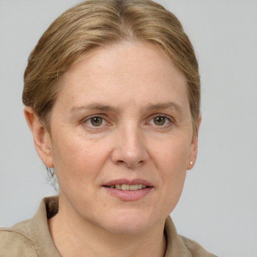 Joyful white adult female with short  brown hair and grey eyes