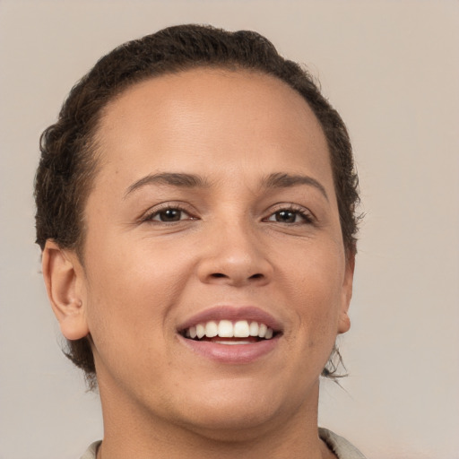 Joyful white young-adult female with short  brown hair and brown eyes