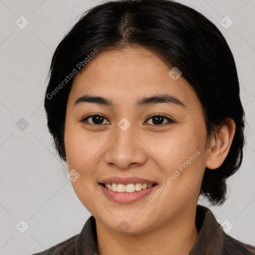 Joyful asian young-adult female with medium  brown hair and brown eyes