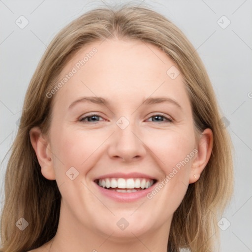 Joyful white young-adult female with medium  brown hair and blue eyes