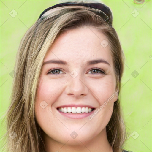 Joyful white young-adult female with long  brown hair and green eyes