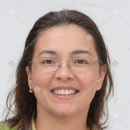 Joyful white adult female with long  brown hair and brown eyes