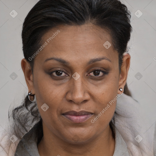 Joyful black adult female with medium  brown hair and brown eyes