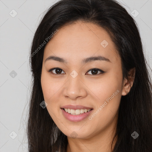 Joyful asian young-adult female with long  brown hair and brown eyes