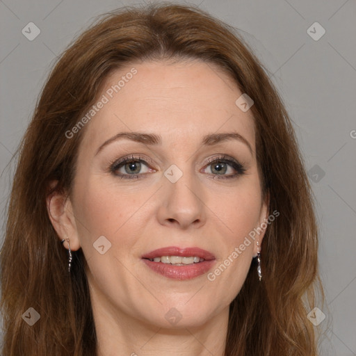 Joyful white adult female with long  brown hair and grey eyes