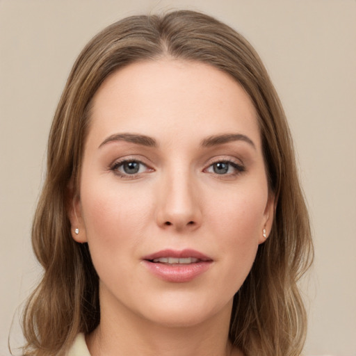 Joyful white young-adult female with long  brown hair and grey eyes