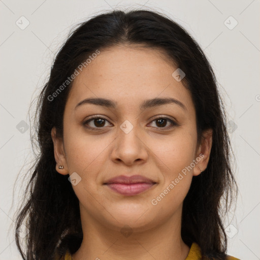 Joyful latino young-adult female with long  brown hair and brown eyes