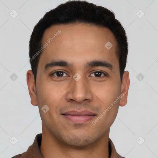 Joyful latino young-adult male with short  brown hair and brown eyes