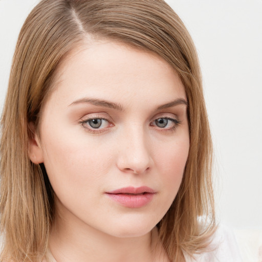 Neutral white young-adult female with long  brown hair and blue eyes