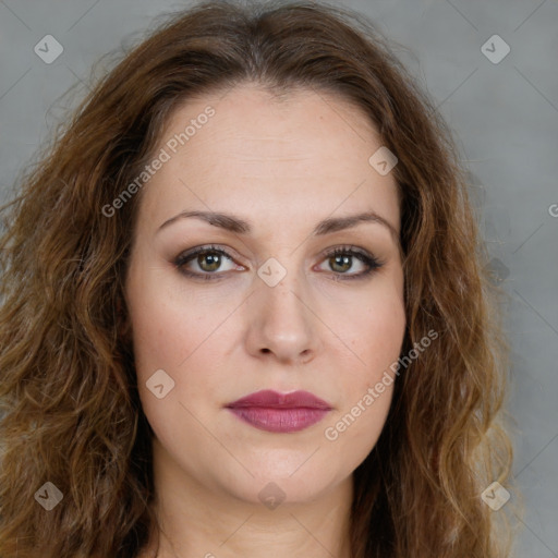 Joyful white young-adult female with long  brown hair and green eyes