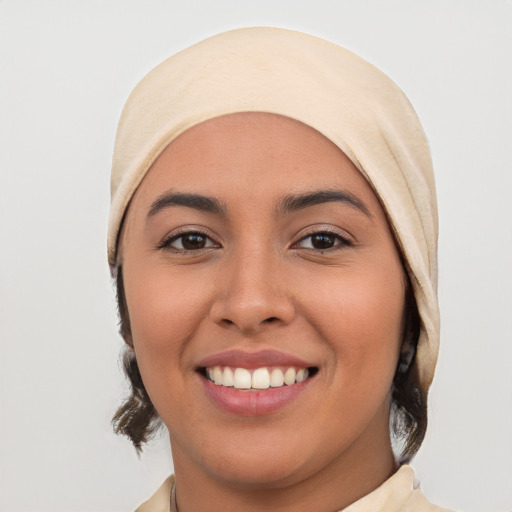 Joyful white young-adult female with medium  black hair and brown eyes