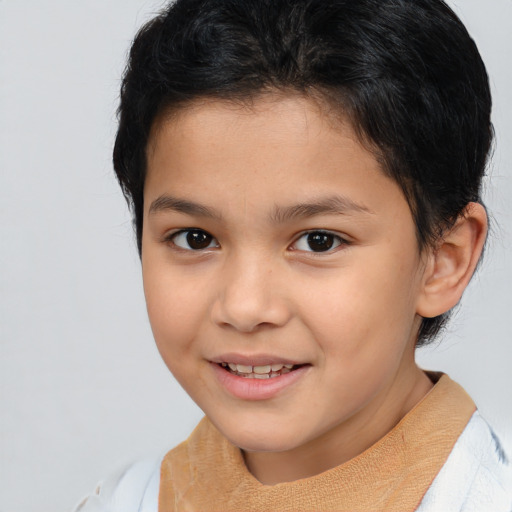 Joyful white child female with short  brown hair and brown eyes