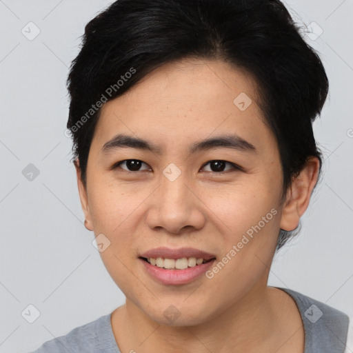 Joyful asian young-adult female with short  brown hair and brown eyes