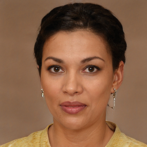 Joyful latino young-adult female with short  brown hair and brown eyes