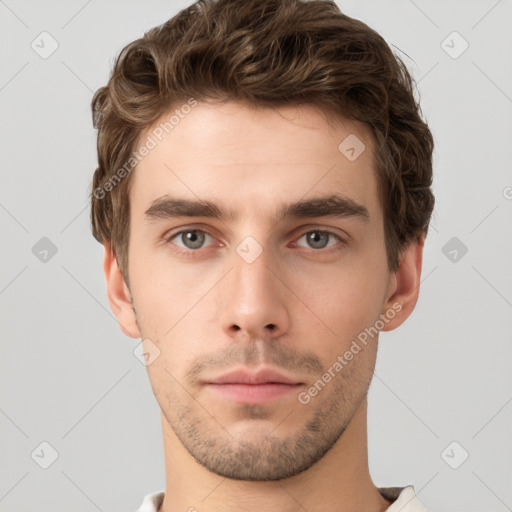 Neutral white young-adult male with short  brown hair and grey eyes