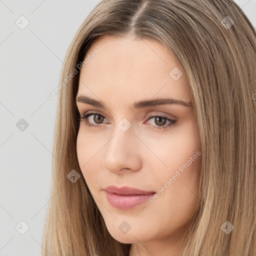 Neutral white young-adult female with long  brown hair and brown eyes