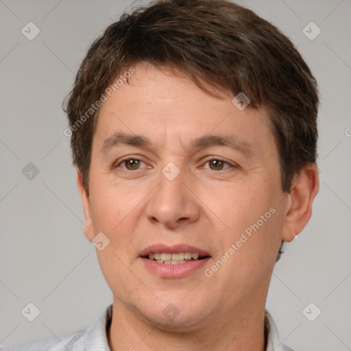 Joyful white adult male with short  brown hair and brown eyes