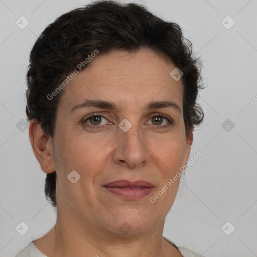 Joyful white adult female with short  brown hair and brown eyes