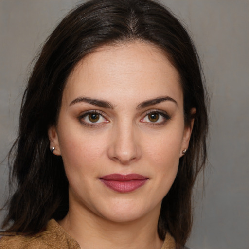 Joyful white young-adult female with medium  brown hair and brown eyes