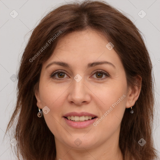 Joyful white adult female with long  brown hair and brown eyes