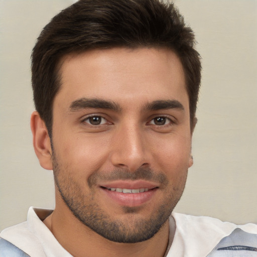 Joyful white young-adult male with short  brown hair and brown eyes