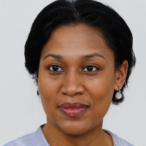 Joyful black adult female with medium  black hair and brown eyes