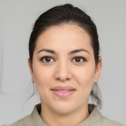 Joyful asian young-adult female with medium  brown hair and brown eyes