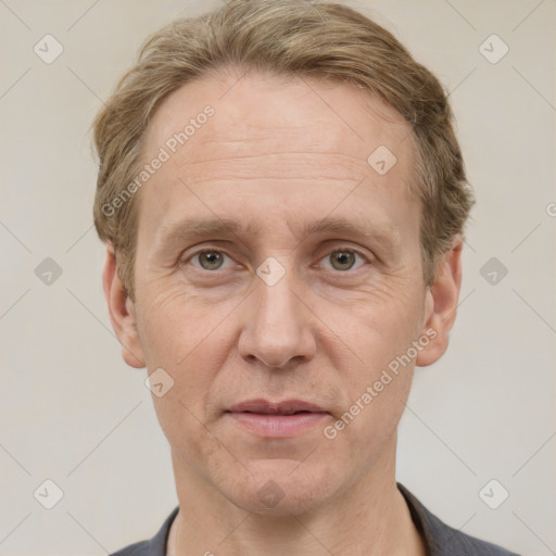 Joyful white adult male with short  brown hair and grey eyes