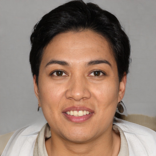 Joyful asian young-adult female with short  brown hair and brown eyes