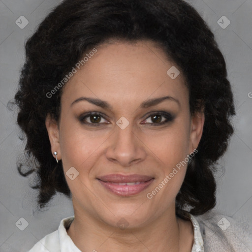 Joyful latino adult female with medium  brown hair and brown eyes