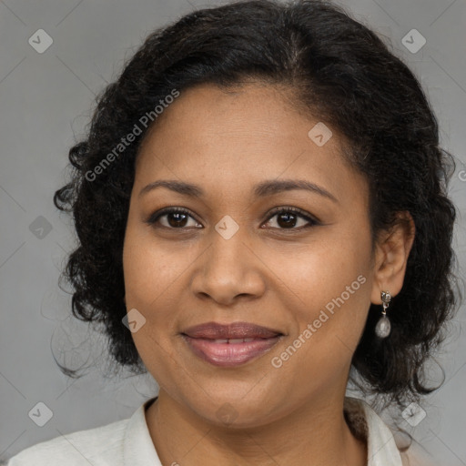 Joyful black adult female with medium  brown hair and brown eyes