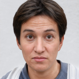 Joyful white adult female with short  brown hair and brown eyes