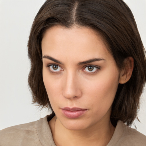 Neutral white young-adult female with medium  brown hair and brown eyes