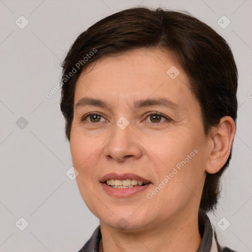 Joyful white adult female with medium  brown hair and brown eyes