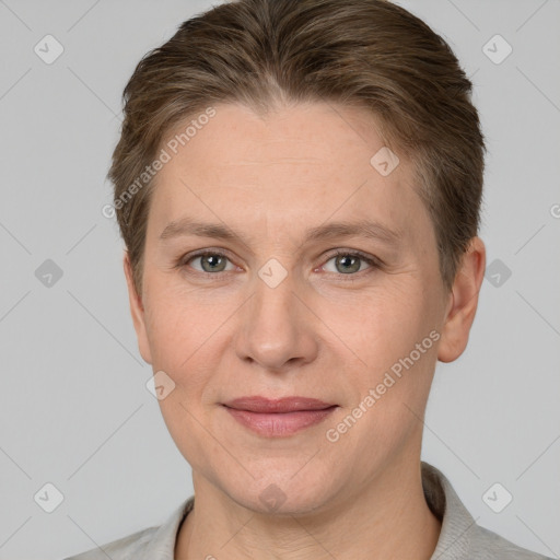 Joyful white adult female with short  brown hair and grey eyes