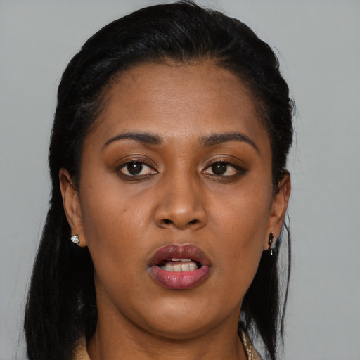 Neutral black young-adult female with long  brown hair and brown eyes