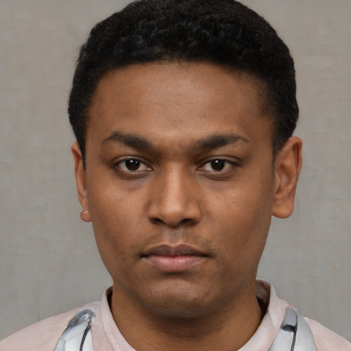 Neutral latino young-adult male with short  black hair and brown eyes