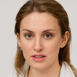 Joyful white young-adult female with medium  brown hair and blue eyes