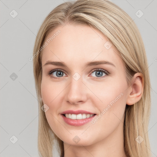 Joyful white young-adult female with long  brown hair and blue eyes