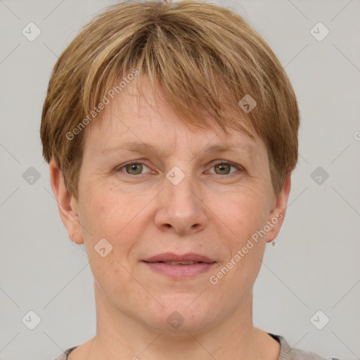 Joyful white adult female with short  brown hair and grey eyes