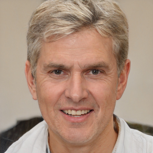 Joyful white middle-aged male with short  brown hair and brown eyes