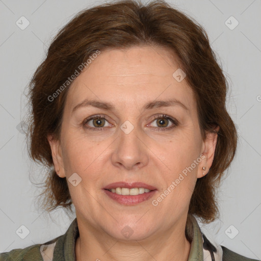 Joyful white adult female with medium  brown hair and grey eyes