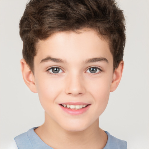 Joyful white child male with short  brown hair and brown eyes