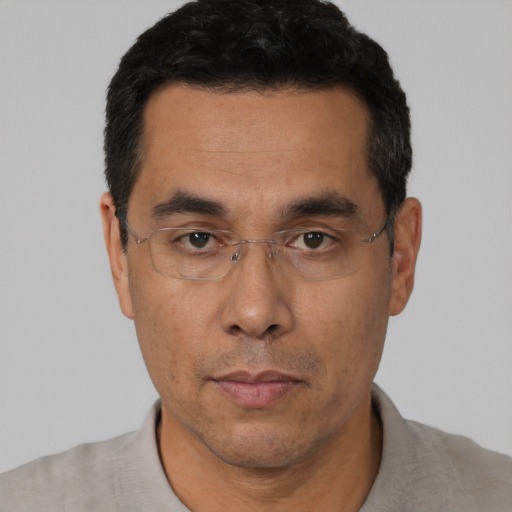 Neutral asian adult male with short  black hair and brown eyes