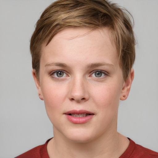 Joyful white young-adult female with short  brown hair and grey eyes