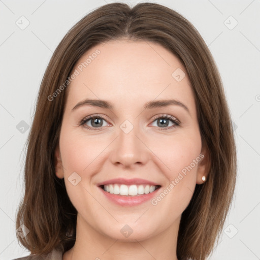 Joyful white young-adult female with long  brown hair and green eyes