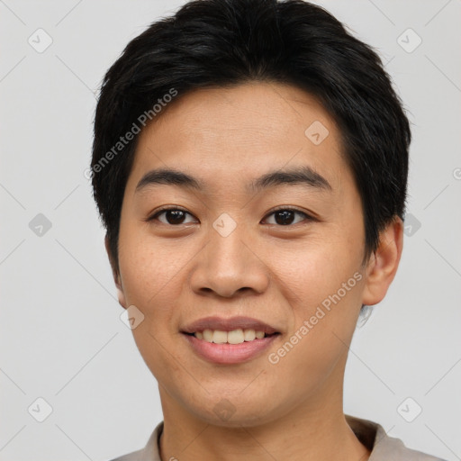 Joyful asian young-adult male with short  black hair and brown eyes