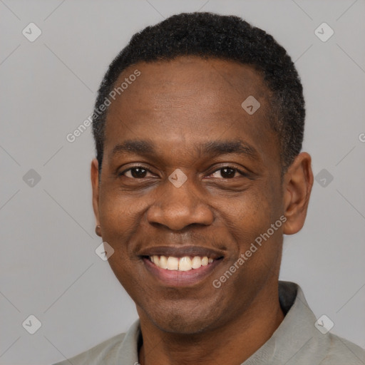 Joyful latino adult male with short  black hair and brown eyes