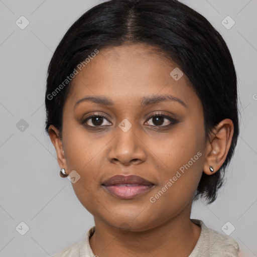 Joyful black young-adult female with medium  brown hair and brown eyes